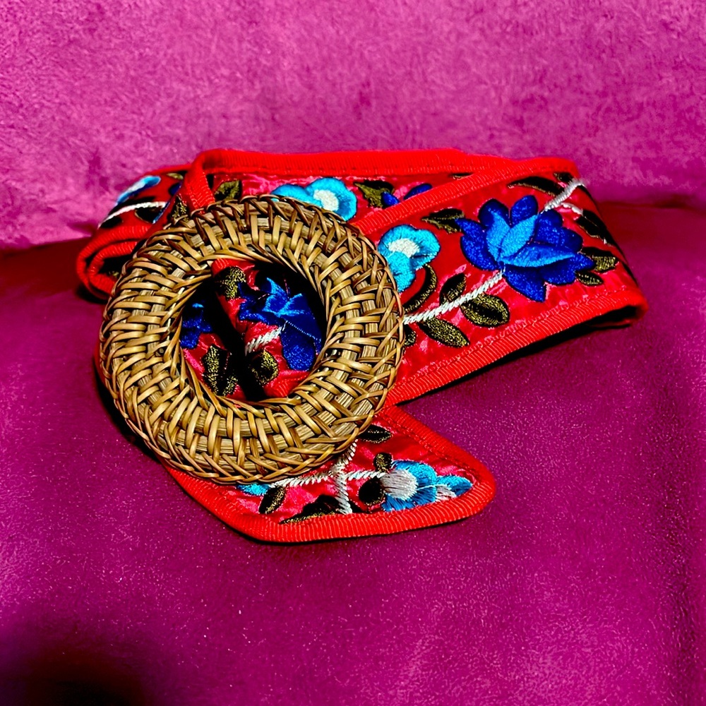 Embroidered red belt with rattan closure from Anthropologie
